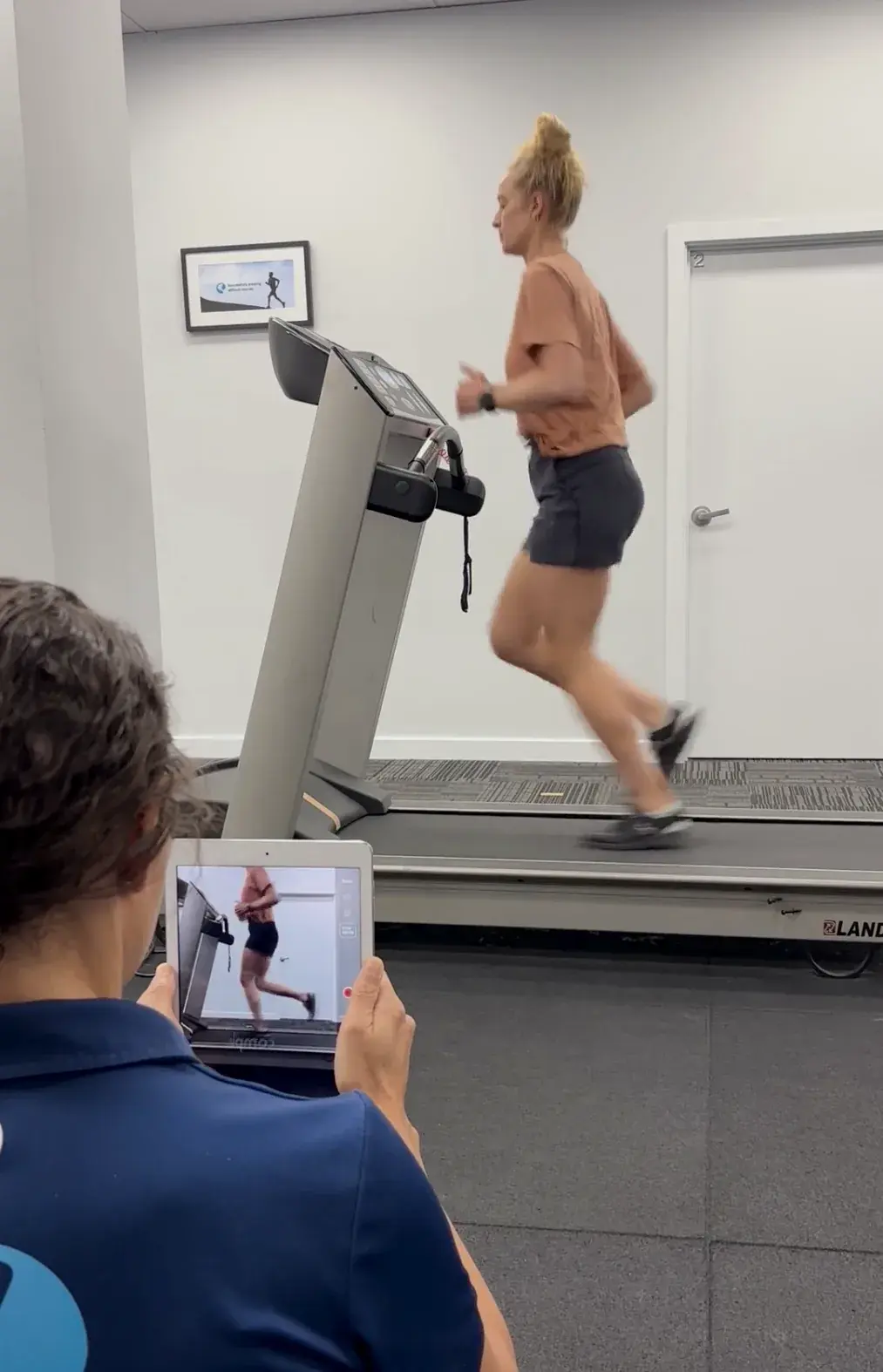Video gait analysis of a runner on a treadmill, filmed on a tablet by a physiotherapist at Complete Physio Richmond