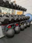 Dumbbells and competition kettlebells in the strength and conditioning space at Complete Physio Richmond