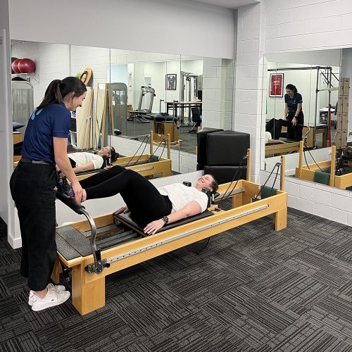 Physio led clinical pilates exercise using a reformer